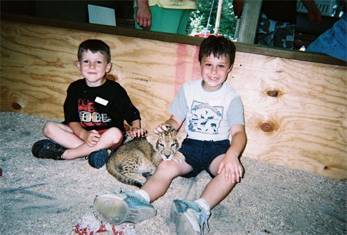 Aaron and Alex chilling with a baby tiger