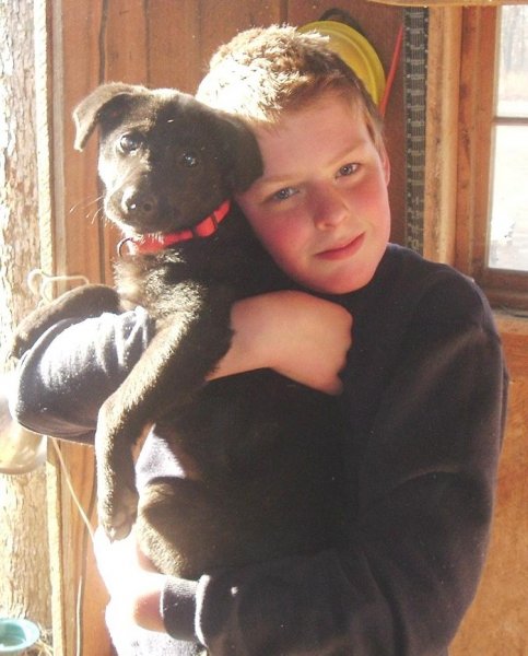 Andrew, age 11, with puppy shot with cheap digital camera